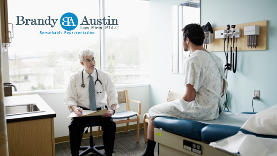 Man in a doctor's office in front of a doctor with brandy austin law firm logo