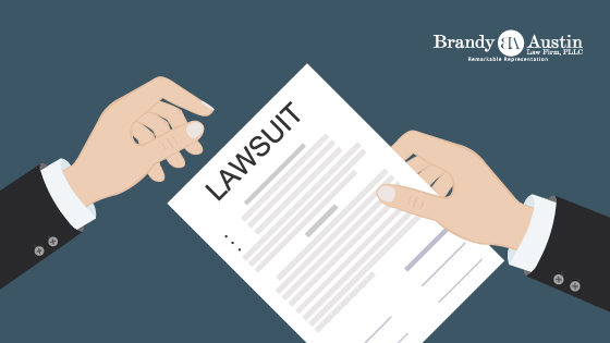 Documents with Lawsuit on Blog Header Brandy Austin Law Firm Logo