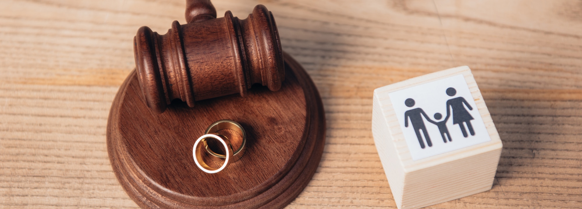rings on a gavel next to divorce stamp on the desk of a Divorce Lawyer Arlington TX